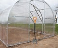 Greenhouse in back garden ready for planting vegetables Royalty Free Stock Photo