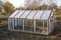 Greenhouse construction in autumn garden