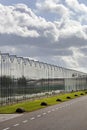 Greenhouse exterior under a sky with nice clouds