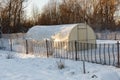 Greenhouse in the vegetable garden in winter.