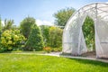 Greenhouse with vegetables in private garden in back yard Royalty Free Stock Photo