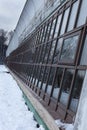 greenhouse windows facing the street in winter