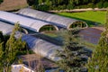 Greenhouses surrounded by green fields in Pamplona, Spain