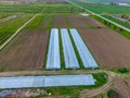 Greenhouses view from above. Long greenhouses for vegetables.