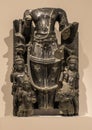 Greenish black stone 9th-10th century stele depicting Hari-Hara on display in the Dallas Museum of Art.