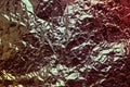 Greenish bronze crumpled foil, wrapper festive background.Dark expensive shiny background. Royalty Free Stock Photo