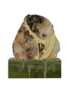 Greenish-gray Jasper mineral on the bar of ofiokaltsit isolated