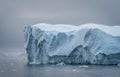 Greenland. The biggest glacier on a planet Jakobshavn. Huge icebergs of different forms in the gulf. Studying of a Royalty Free Stock Photo