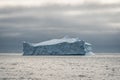 Greenland. The biggest glacier on a planet Jakobshavn. Huge icebergs of different forms in the gulf. Studying of a Royalty Free Stock Photo