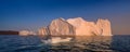 Floating glaciers in the rays of the setting sun at polar night