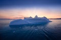 Floating glaciers in the rays of the setting sun at polar night