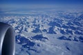 GREENLAND - 10 MAY 2018: View from the aircraft window of the engine of a Boeing 787 over the icebergs of Greenland Royalty Free Stock Photo