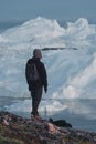 Greenland tourist man explorer overlooking Icefjord in Ilulissat. Travel in arctic landscape nature with icebergs Royalty Free Stock Photo