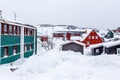 Greenlandic Inuit houses among covered in snow a suburb of arct