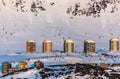 Greenlandic multistorey living buildings with mountains in the b