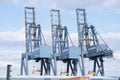 Greenock, Inverclyde / Scotland - 04/16/2019: Clydeport carrier cranes for transportation lifting of containers and freight onto s