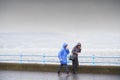 Greenock, Inverclyde, Scotland, UK, October 2nd 2021, Elderly women walking in heavy rain during British wet summer UK