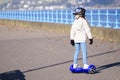 Young girl practising balance activity on hoverboard
