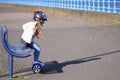 Young girl practising balance activity on hoverboard