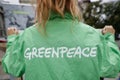 Greenpeace activist holding a banner at a protest Royalty Free Stock Photo