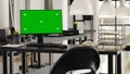 Greenscreen display placed on desk Royalty Free Stock Photo