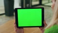 Greenscreen pad entrepreneur hands holding close up. Woman reading mockup screen