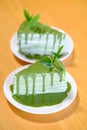 greentea crepe cake on wood table Royalty Free Stock Photo
