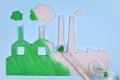 Greenwashing concept with cardboard factory being painted green Royalty Free Stock Photo