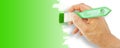 Greenwashing concept with hand which paints in green - concept image with copy space Royalty Free Stock Photo