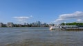 Greenwich Pier with river cruiser waiting to depart.