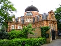 Greenwich observatory with beautiful green grass and clouds land