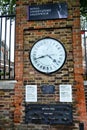 Greenwich observatory clock time zone on brick wall Royalty Free Stock Photo