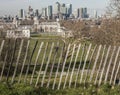 The Greenwich park - a fence and tall buildings of Canary Wharf.