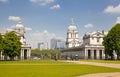 Greenwich Royal navy office, classic colonnade and Canary Wharf business district on the background