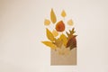 Greeting card for autumn. Creative design for Envelope with colorful yellow fallen leaves. Bouquet in the form of an envelope