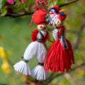 Greeting card background for the arrival of spring. Red-white man and woman figures martenitsa - Bulgarian spring symbol