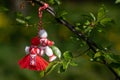 Greeting card background for the arrival of spring. Red-white man and woman figures martenitsa - Bulgarian spring symbol