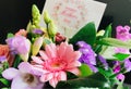 Greeting card and beautiful fresh flowers for MotherÃ¢â¬â¢s Day.