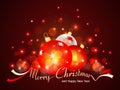 Greeting card with Christmas balls, bokeh and the Merry Christmas in the form of ribbons Royalty Free Stock Photo