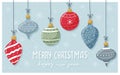 A greeting card. Christmas toys with hand-drawn patterns and ornaments and handwritten words Merry Christmas and Happy New Year. Royalty Free Stock Photo