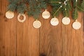 Greeting card with decor gingerbread cookies, fir tree branch on Royalty Free Stock Photo