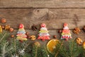 Greeting card with decor gingerbread cookies, fir tree branch on Royalty Free Stock Photo