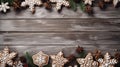 Greeting card with decor gingerbread cookies snowflakes, fir tree branch on old wooden background. Overhead of Christmas New Year Royalty Free Stock Photo