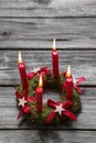 Greeting card: Four red burning advent candles on wooden grey ba Royalty Free Stock Photo