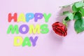 Greeting card for Happy Mother`s Day with a text. Red rose on the pink background with text congratulation for Happy Mom`s Day Royalty Free Stock Photo