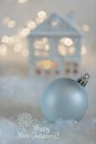 Greeting card Happy New Year. Ball and Beautiful blurred blue background of winter decoration for the holiday. Soft focus Royalty Free Stock Photo
