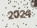 Greeting card - happy new year with numbers 2024 and silver star shape glitter on light background Royalty Free Stock Photo
