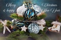 Greeting card with home decoration with colorful Christmas ornaments on tiered tray against grunge background
