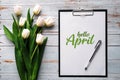 Greeting card with the inscription Hello April. Bouquet of white Tulip flowers Royalty Free Stock Photo