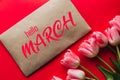 Greeting card with the inscription Hello March. Bouquet of pink Tulip flowers